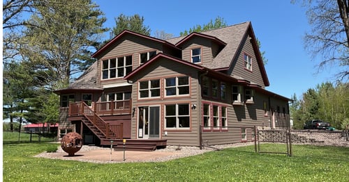 Rice Lake, WI exterior remodeling project featuring LP SmartSide siding repairs and new roofing on the home and attached garage.