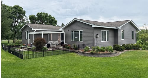 Stillwater, MN home after LP SmartSide siding installation with board-and-batten courtyard accents and new trim.