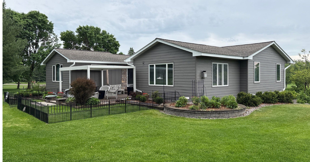 Stillwater, MN home after LP SmartSide siding installation with board-and-batten courtyard accents and new trim.