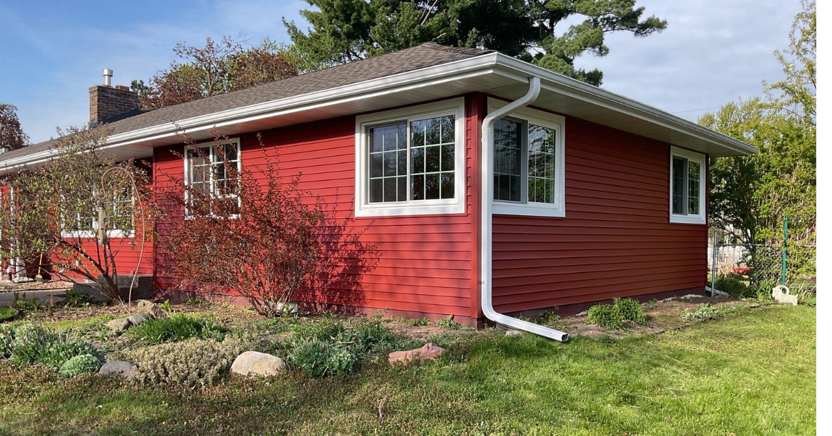 Vinyl siding replacement project in St. Paul, MN showing the home's updated exterior and garage.